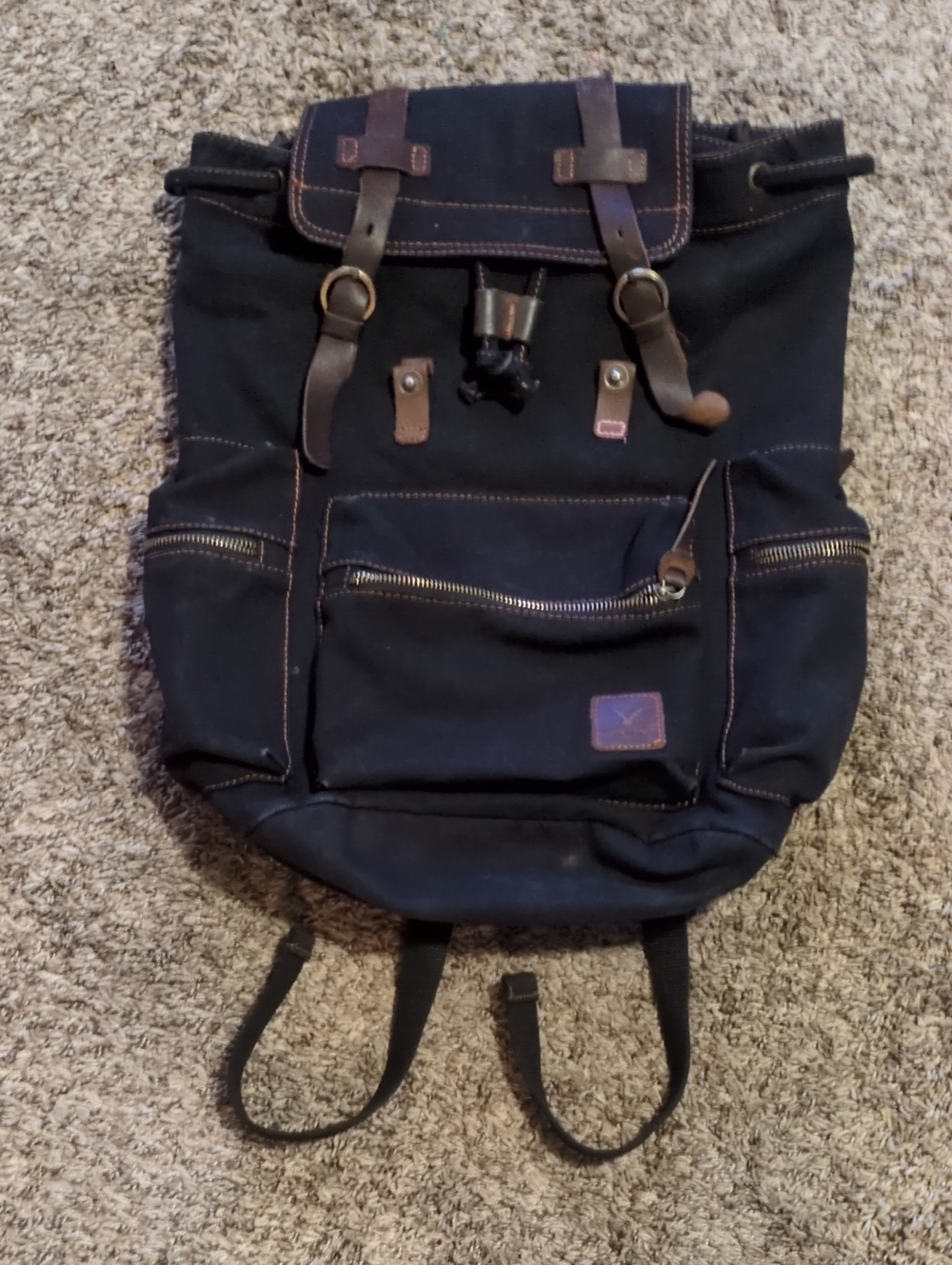 Classic Black Canvas Backpack with Brown Leather Accents